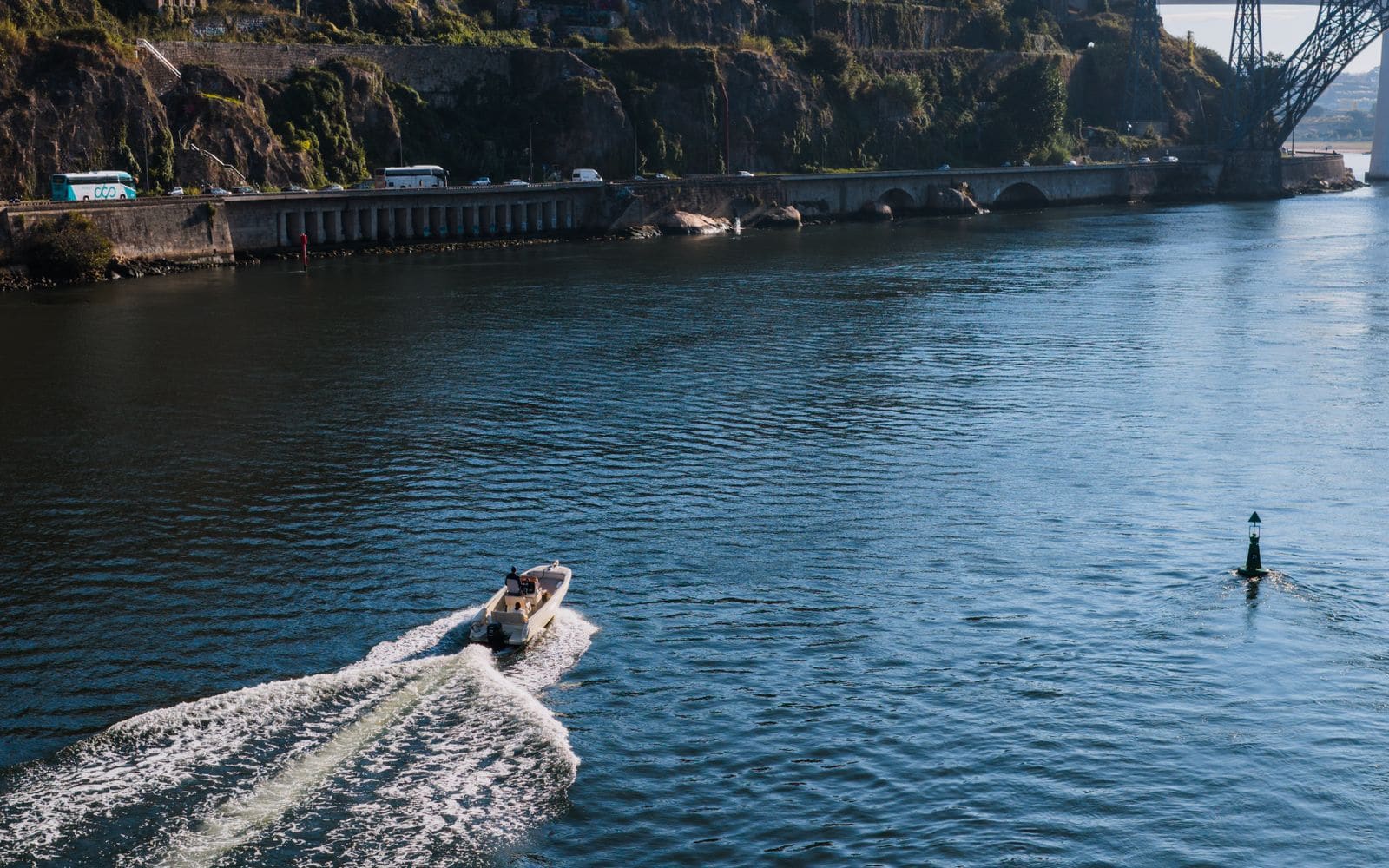 Boat cruising on the Douro River near Porto's historic waterfront